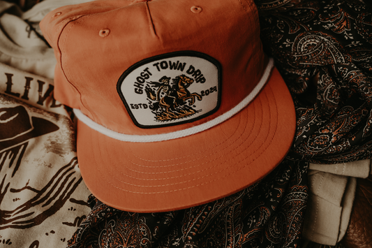 Orange Embroidered Ghost Town Cowboy logo hat