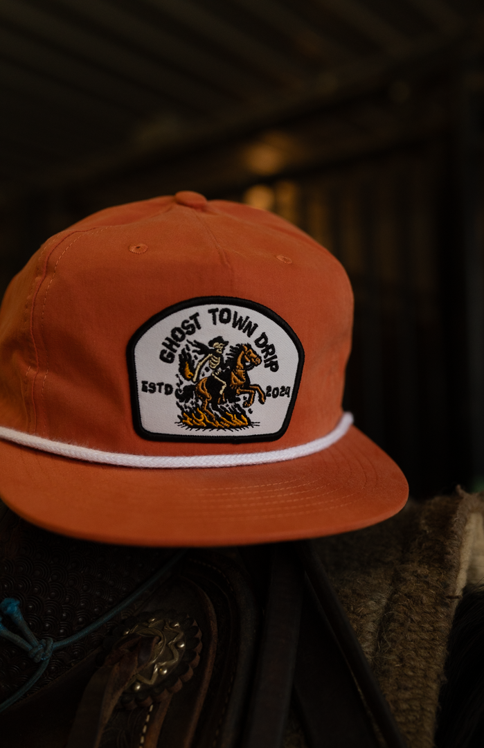 Orange Embroidered Ghost Town Cowboy logo hat